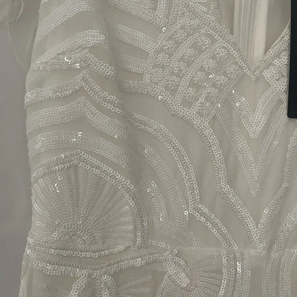 Fashion Nova Ivory Beaded V-Neck Wedding Gown with Feather Shoulders - Picture 3 of 9